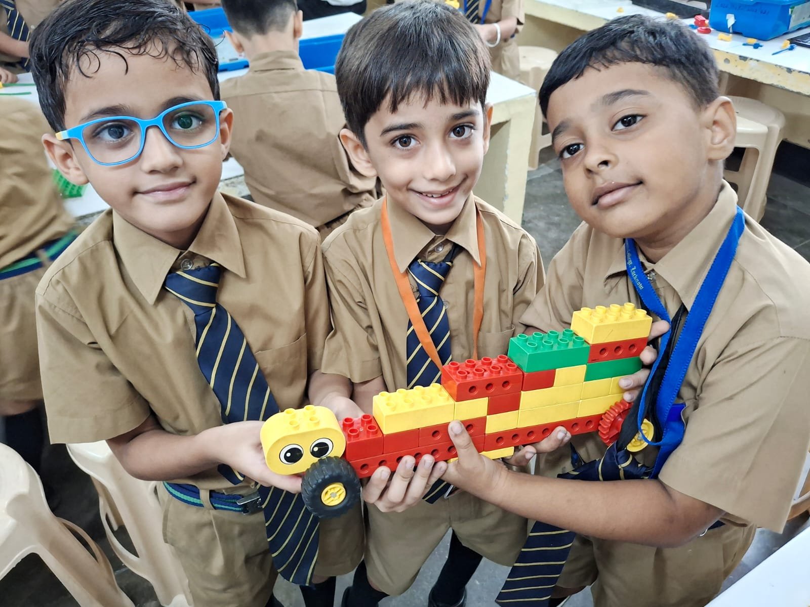 Students building a LEGO tower model